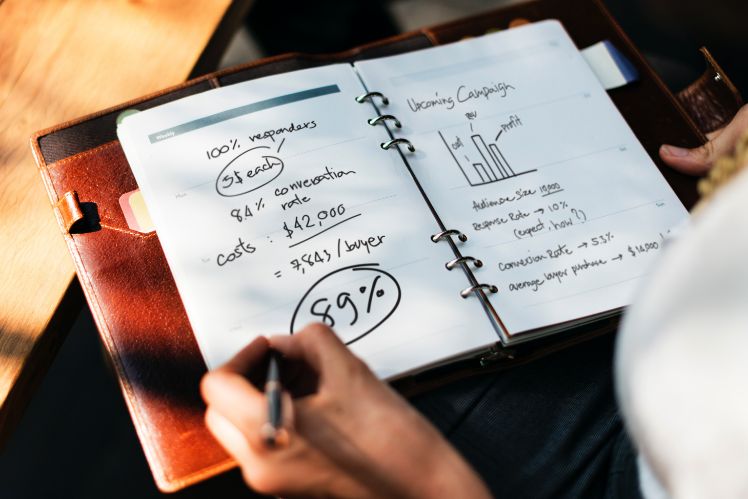 professionnal is writing numbers on a copybook professionnal is writing numbers on a copybook