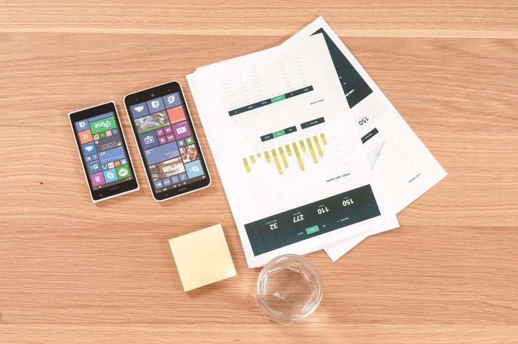 smartphones with papers on the table