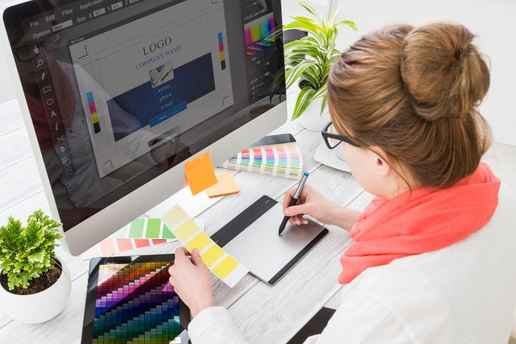 woman drawing on a computer