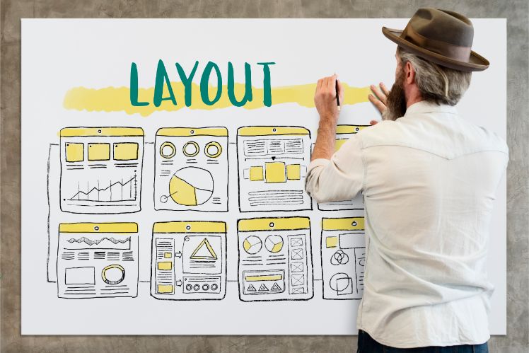 man standing in front of a whiteboard creating the layout of a website man standing in front of a whiteboard creating the layout of a website