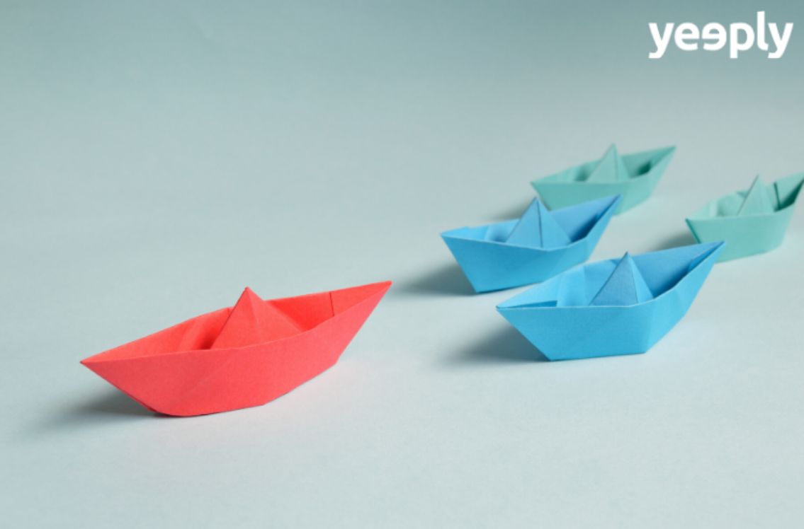 four paper boats in different colours