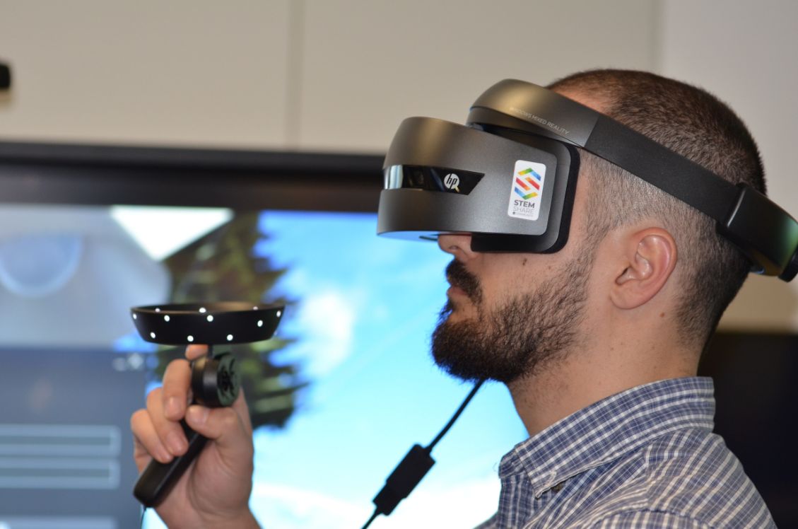 man using VR glasses and devices