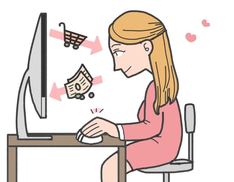 donna al computer facendo acquisti